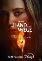 Die Hand an der Wiege